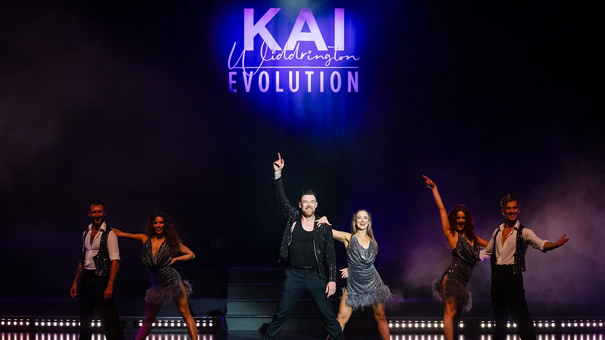 Kai Widdrington and dancers on stage in Evolution